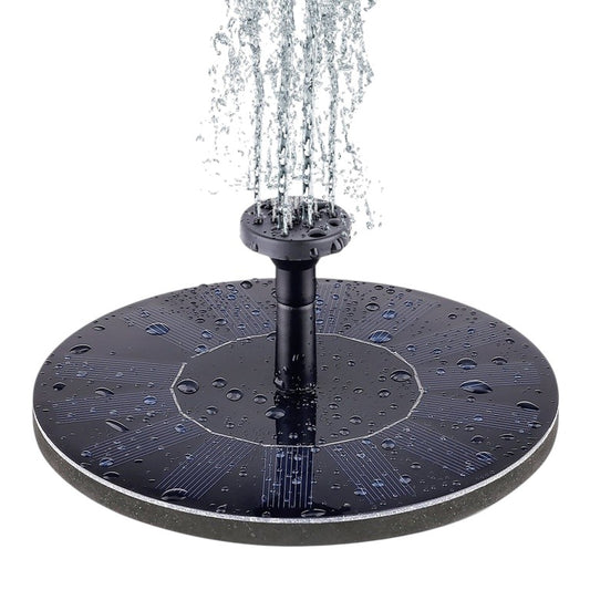 Solar fountain pump floating in bird bath with water spraying upward, 1.4W solar powered, no wiring required